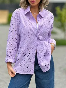 Detail of lavender oversized long sleeve shirt with intricate eyelet embroidery