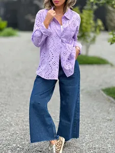 Detailed view of women's purple eyelet embroidered shirt with stylish hollow-out patterns