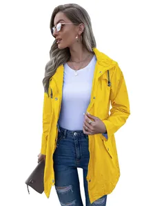 Detailed view of yellow hooded waterproof raincoat for women with zipper closure