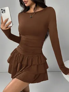 Close-up of a coffee brown long sleeve tiered ruffle mini dress with bodycon fit