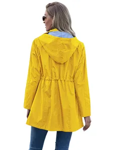 Detailed back view of women's yellow hooded rain jacket with stylish striped lining