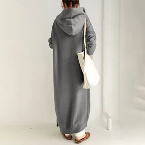Back view of women's grey oversized long hooded sweatshirt dress with fleece lining