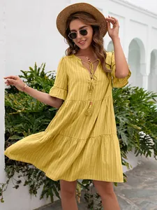 Yellow V-neck tiered midi dress with half sleeves in a loose casual style for women