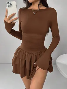 Detail view of a stylish brown long-sleeved slim-fit mini dress with tiered ruffles.