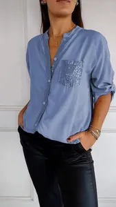 Blue women's casual long-sleeved shirt with a sparkling sequined pocket detail