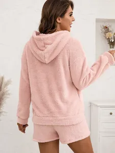 Back view of a cozy pink fuzzy hooded lounge set for women.
