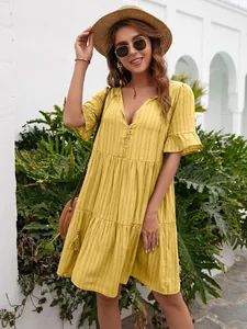 Detailed view of a yellow tiered casual dress featuring V-neck and ruffle sleeves