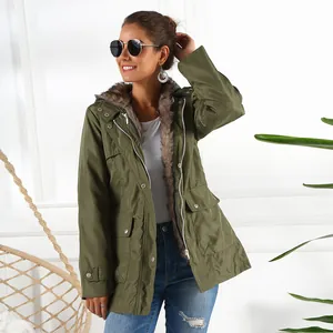 Detailed view of women's olive green parka coat with cozy fur-lined hood and collar