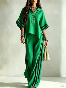 Stylish green linen-style two-piece set featuring wide-leg pants with black stripes