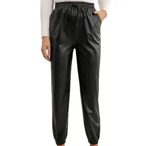 Women's black faux leather joggers with elastic drawstring waist and cuffed ankles.