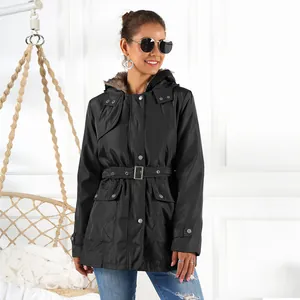 Stylish women's black mid-length winter parka featuring a faux fur hood and waist belt detail