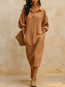 Full-length camel ribbed knit sweater dress with pockets and V-neck collar detail.