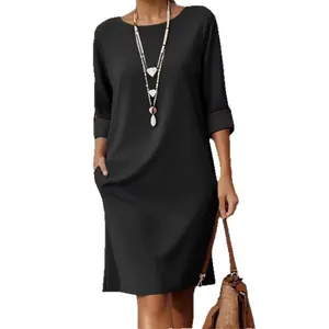 Robe mi-longue élégante à col rond, couleur unie avec manches mi-longues et poches