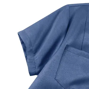 Detailed close-up showing the sleeve stitching and pocket of this blue denim dress