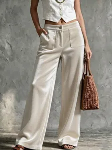 Pantalon élégant en velours à taille haute, jambes larges, coupe droite et poches.