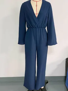 Front view of a navy blue long-sleeved jumpsuit featuring a deep V-neck and elastic waist.