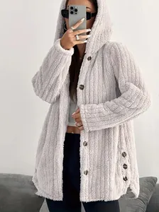 Women's oversized fuzzy hooded jacket in solid color with textured fleece material