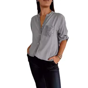 Casual gray women's button-down shirt with a sparkling sequined pocket and long sleeves