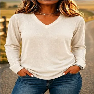 Close-up of comfortable beige V-neck long sleeve t-shirt with soft fabric texture