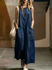 Front view of a navy blue sleeveless maxi dress with two functional side pockets.