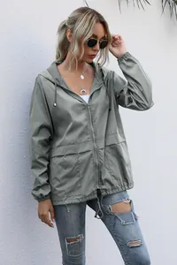 Professional model showcases a lightweight grey-green hooded outdoor windbreaker jacket