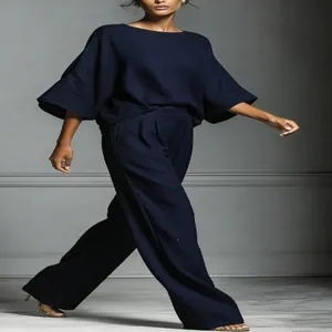 Elegant navy blue linen set featuring stylish bell sleeves and wide-leg trousers detail
