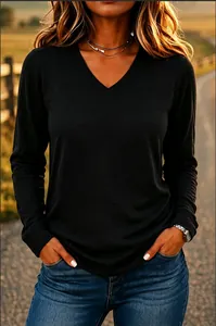 Casual black long-sleeved V-neck T-shirt with a relaxed fit worn by model in outdoor light