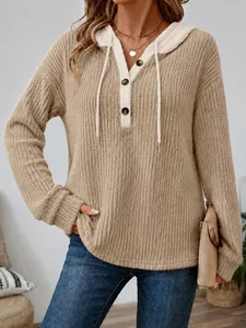 Detailed view of the khaki ribbed texture hoodie featuring contrast white hood and buttons