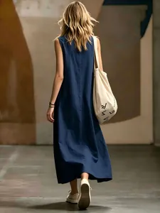 Back view of a sleeveless navy blue maxi dress featuring a minimalist elegant silhouette