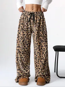 Stylish women's leopard print wide-leg floor-length pants featuring a waist drawstring bow.