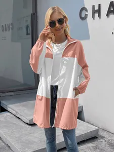 Stylish outdoor color-block hooded windbreaker jacket with pockets shown on a model outdoors