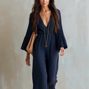 Detail of navy blue long sleeve V-neck bohemian jumpsuit with elastic waist