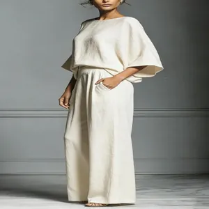 Elegant linen two-piece set with flare sleeves and wide-leg trousers in beige color