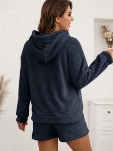 Back view of cozy plush hooded sweatshirt and shorts set in navy blue fleece texture.