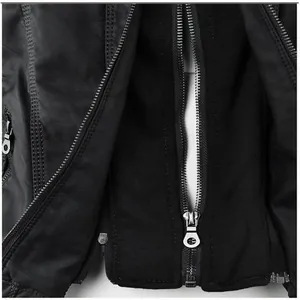 Detailed close-up view of a black leather jacket featuring a silver metal zipper.