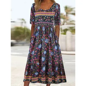 Bohemian floral print short sleeve scoop neck midi dress with pockets and empire waistline