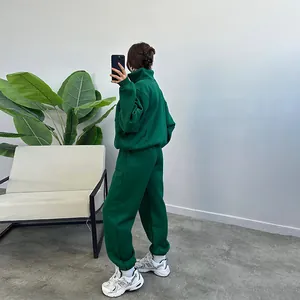 Side view of a green fleece tracksuit set for women with zip-up hoodie and joggers