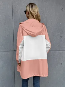 Back view of a hooded color-blocked waterproof outdoor jacket in pink and white.
