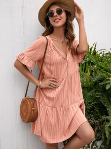 Stylish peach V-neck summer dress featuring ruffle sleeves and a subtle striped texture
