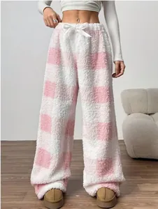 Detail view of pink and white plaid fuzzy wide-leg trousers with ribbon drawstring