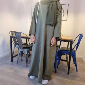 Full-length view of a solid olive green loose long robe with matching modest hijab