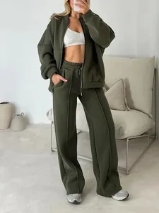 Detail view of olive green two-piece tracksuit featuring zip-up jacket and wide-leg pants