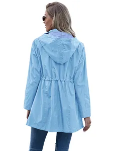 Back view of women's light blue mid-length hooded raincoat jacket with striped lining