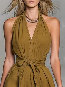 Detailed view of an olive green halter neck V-neck holiday dress with waist tie