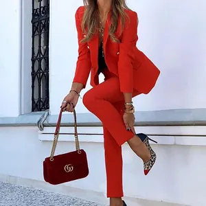 Elegant red two-piece suit set for women featuring a tailored blazer and slim pants