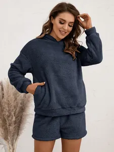Close-up detail of a cozy navy blue fuzzy fleece hoodie and shorts loungewear set