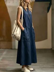 Detail of navy blue sleeveless maxi dress with pockets and elegant minimalist cut