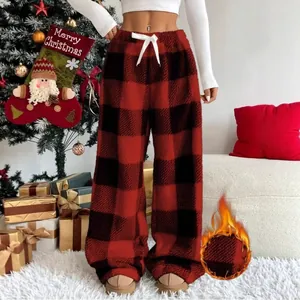 Festive red and black buffalo plaid fleece wide-leg pants featuring warm plush lining detail