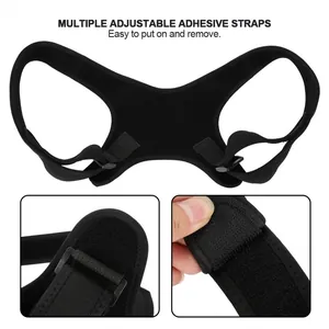 Detail view of adjustable adhesive straps on black posture corrector brace