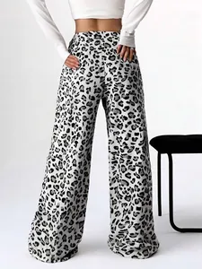 Close-up back view showing the leopard print pattern on these stylish wide-leg trousers